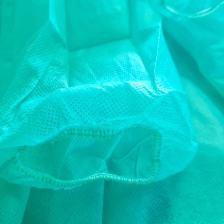 Fartuch jednorazowy zielony M z gumką (flizelina 24g) 100szt